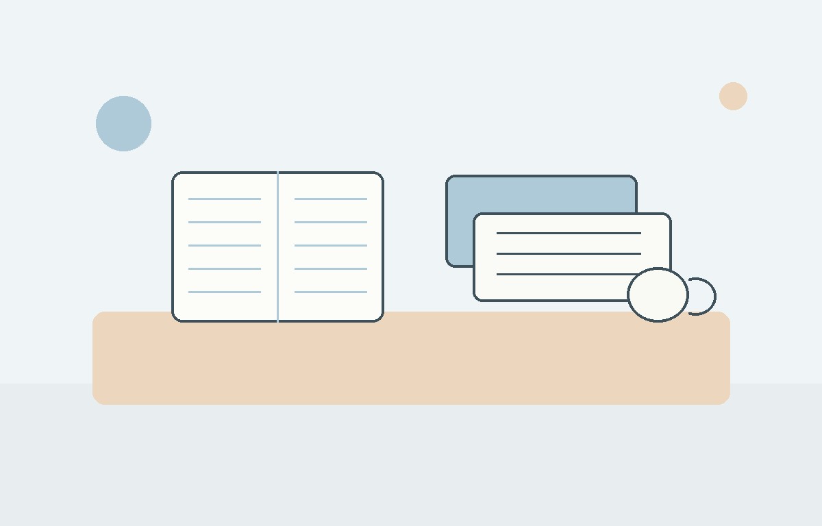 Laptop and structured digital notes beside a notebook